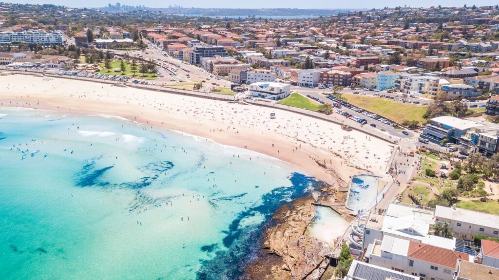 Sydney's most famous stretch of sand, with turquoise waves and surfers everywhere. It's got that laid-back Aussie beach culture – rent a board or just lounge. The entrance is flanked by icebergs pools and cafes; grab fish and chips and watch the sunset.