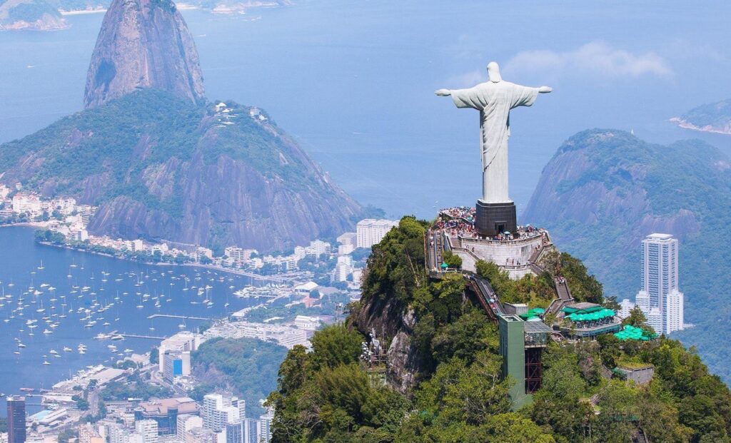 Up on Corcovado, this massive statue's got arms wide open over the city—views are insane, seeing beaches, mountains, and favelas all at once. Take the train up through Tijuca Forest for that jungle feel. I spent an hour just staring out, feeling tiny. Go early or late to dodge the selfie mobs; free entry sometimes after hours, but check ahead.