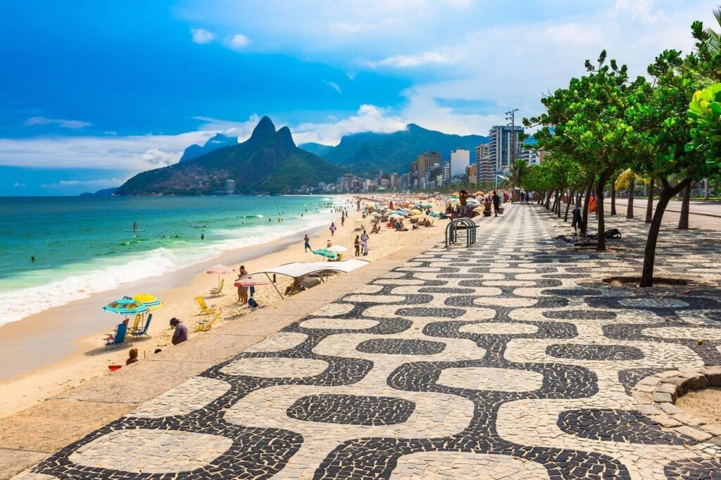 Chiller than Copacabana, with a trendy crowd and sections for everyone—surfers, families, LGBTQ+ spots. The Dois Irmãos mountains frame it perfectly. Rent a bike along the promenade or grab an açaí bowl. It's got those Central Park vibes but with ocean spray.