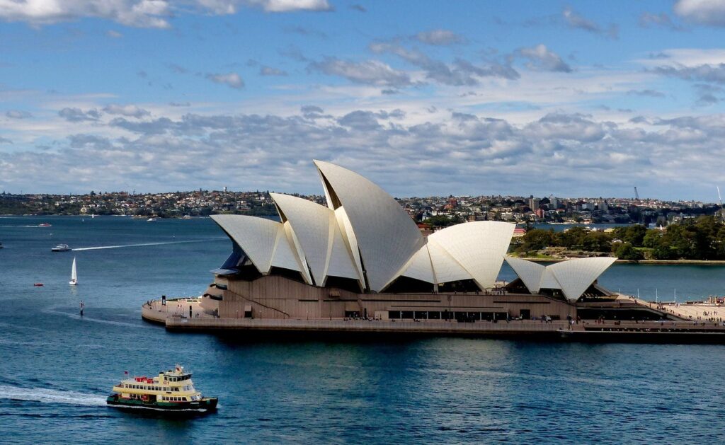 This architectural stunner is Sydney's crown jewel, with its white sails glowing against the harbor. Take a guided tour inside to see the theaters and learn about its wild construction story – it's way more than just a photo op.