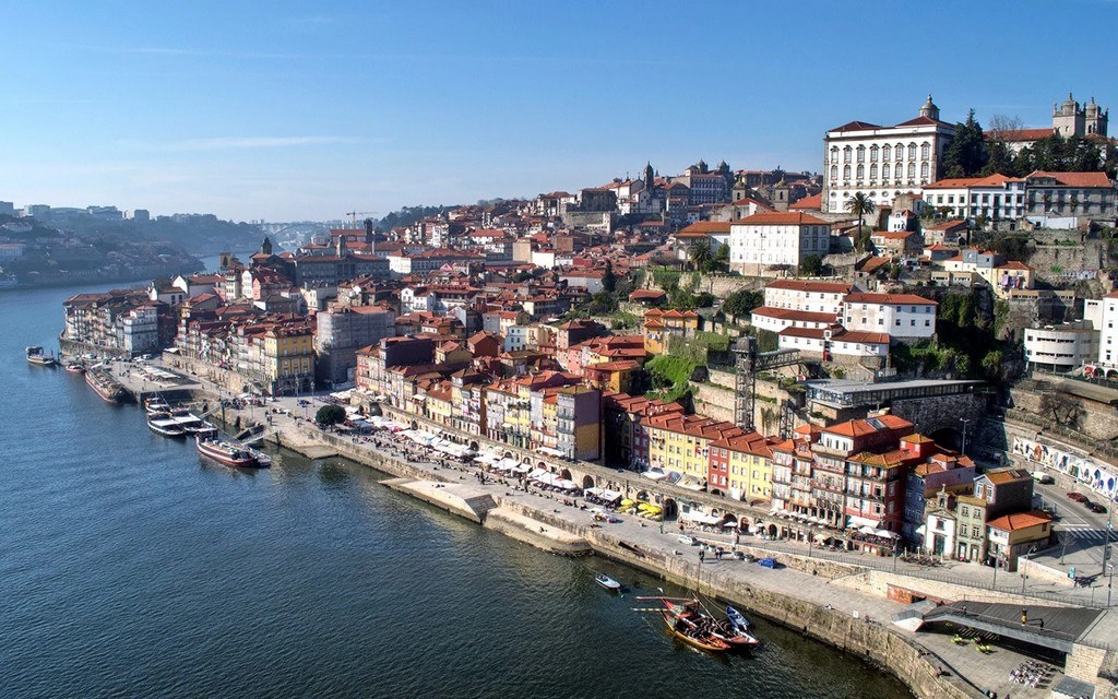 This is the heart and soul of Porto. As soon as you arrive, you’ll be drawn to the buzzing energy of the riverfront. The colorful buildings feel like they’re stacked on top of each other, creating an enchanting view from across the river. Grab a coffee, watch the traditional rabelo boats glide by, and soak it all in.