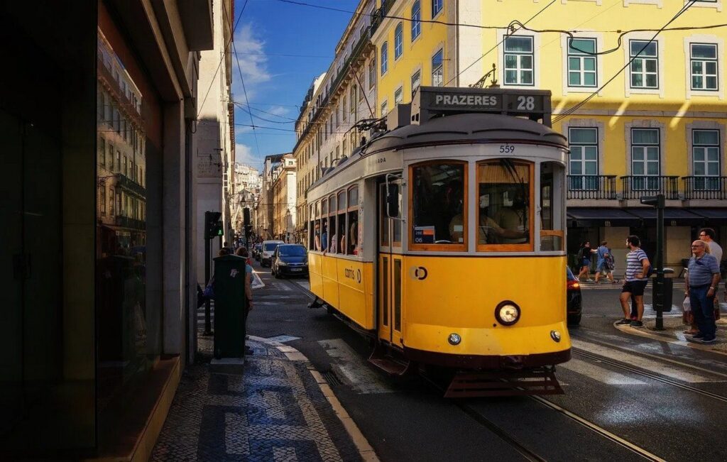 The iconic yellow tram weaves through historic areas (~€3 on board). Hop on early to avoid lines; it’s bumpy but fun, passing Alfama and viewpoints. Great for photos and feeling like a local.