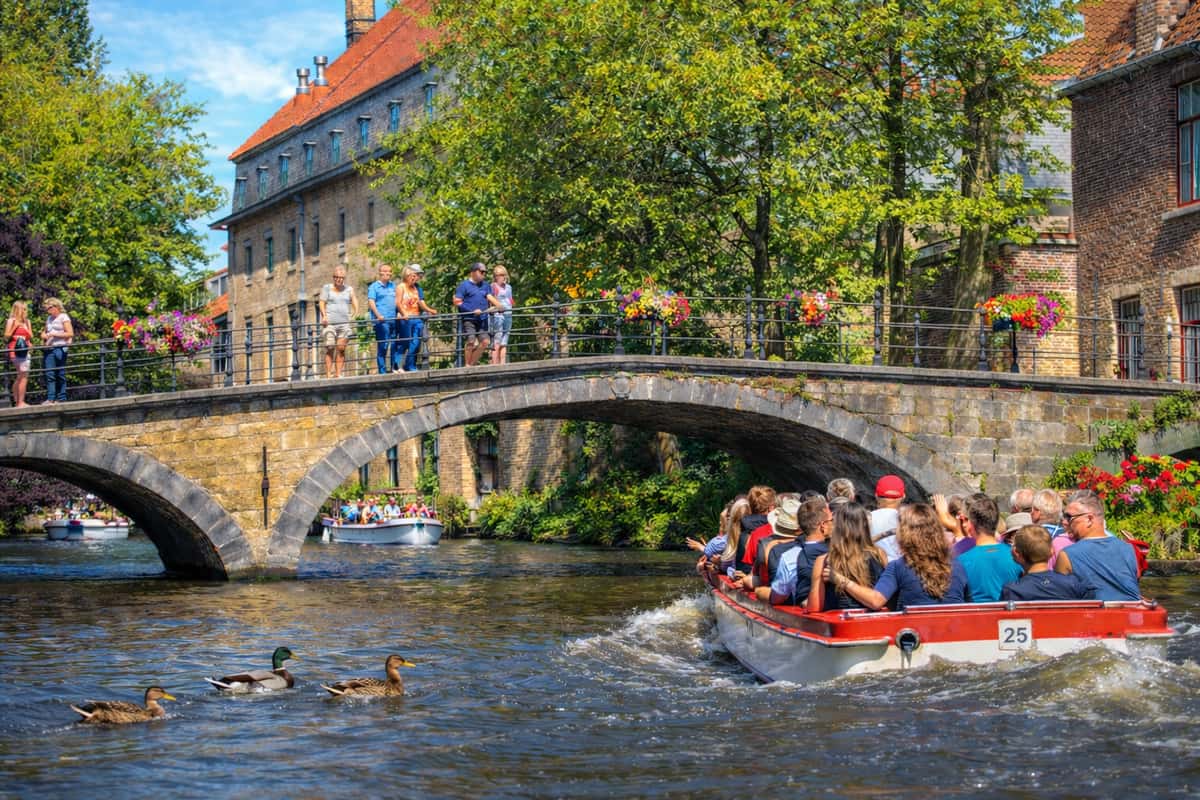 Visit the fairytale cities of Bruges and Ghent on a guided day trip from Brussels. See medieval landmarks and enjoy scenic canals. Book your tickets now!