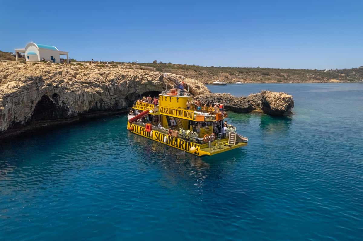 and sea caves on a glass-bottom boat from Protaras. See the ghost town and swim with turtles. Book your tickets now!